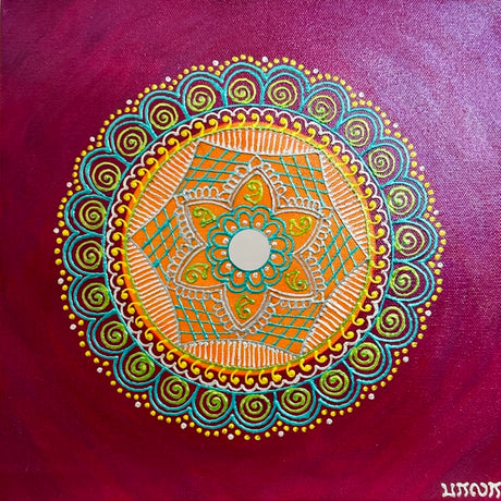 Colorful mandala design on a purple background
